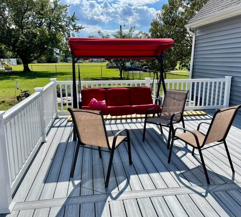 After photo of a Trex Foggy Wharf composite deck resurface featuring custom white vinyl railings by Titan Decks.