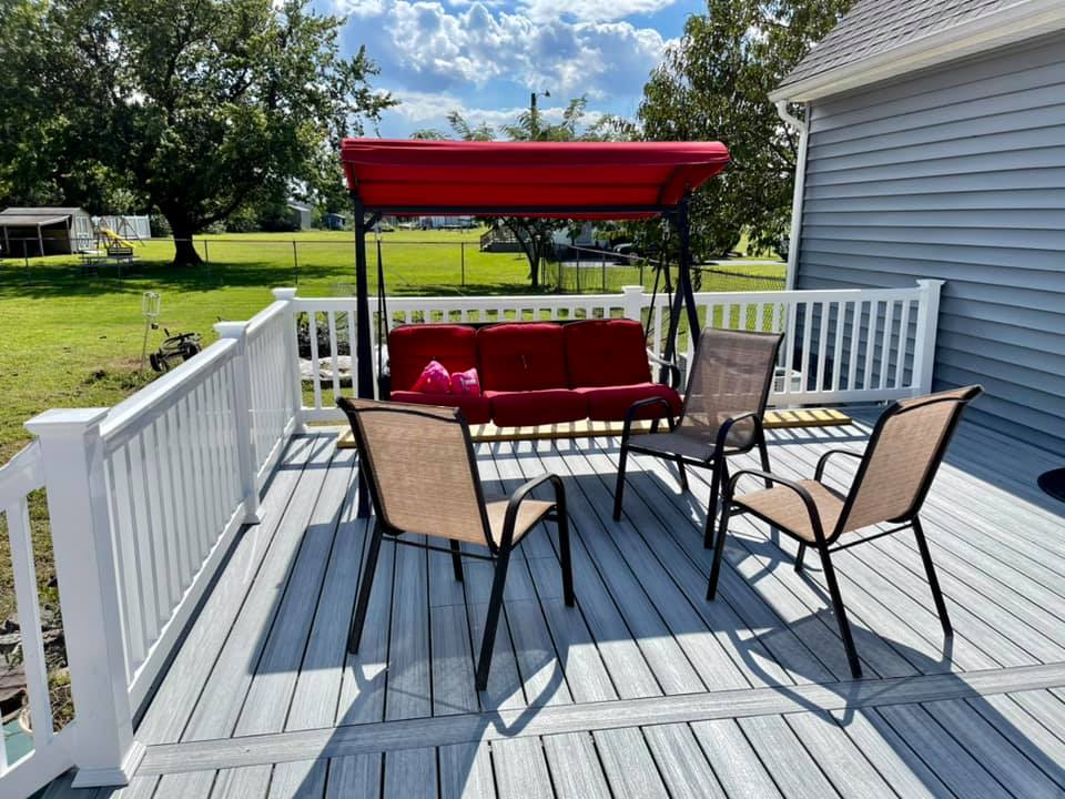 After photo of a Trex Foggy Wharf composite deck resurface featuring custom white vinyl railings by Titan Decks.