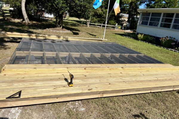 Ground-level wood deck construction and framing by Titan Decks in North Carolina.