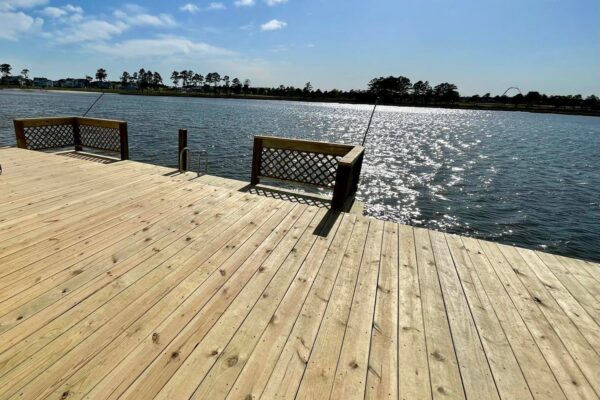New wood dock and deck surface with built-in railing North Carolina by Titan Decks.
