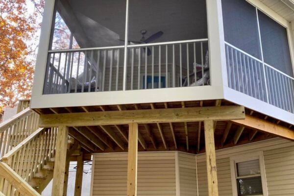 Structural view of an elevated screened-in wood porch and deck construction in North Carolina by Titan Decks.
