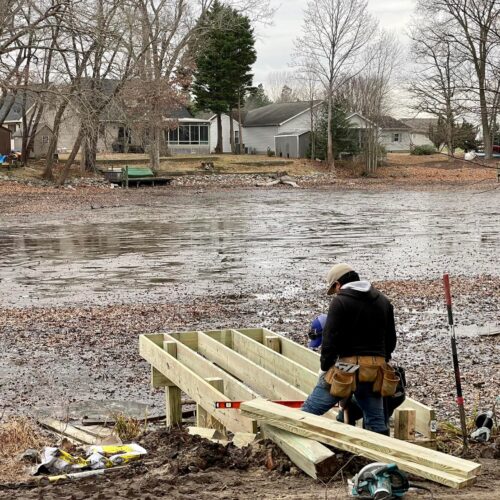 Custom-Wood-Dock-Deck-Construction-NC Contractor building a custom wood dock and deck on the water in North Carolina by Titan Decks.