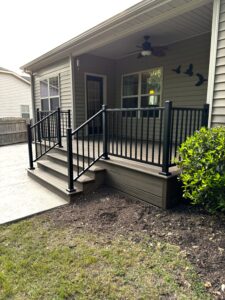 Completed Trex Transcend Toasted Sand deck with black composite railings in Angier, NC.