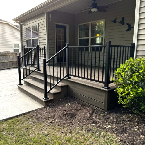 Completed Trex Transcend Toasted Sand deck with black composite railings in Angier, NC.