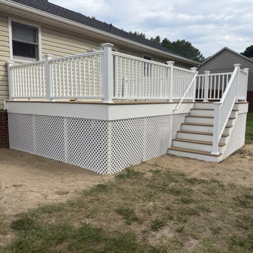 New custom composite deck with white railing built by Titan Decks in Cameron, NC