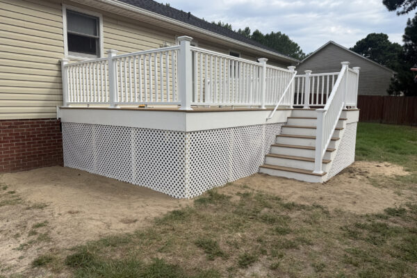 New custom composite deck with white railing built by Titan Decks in Cameron, NC