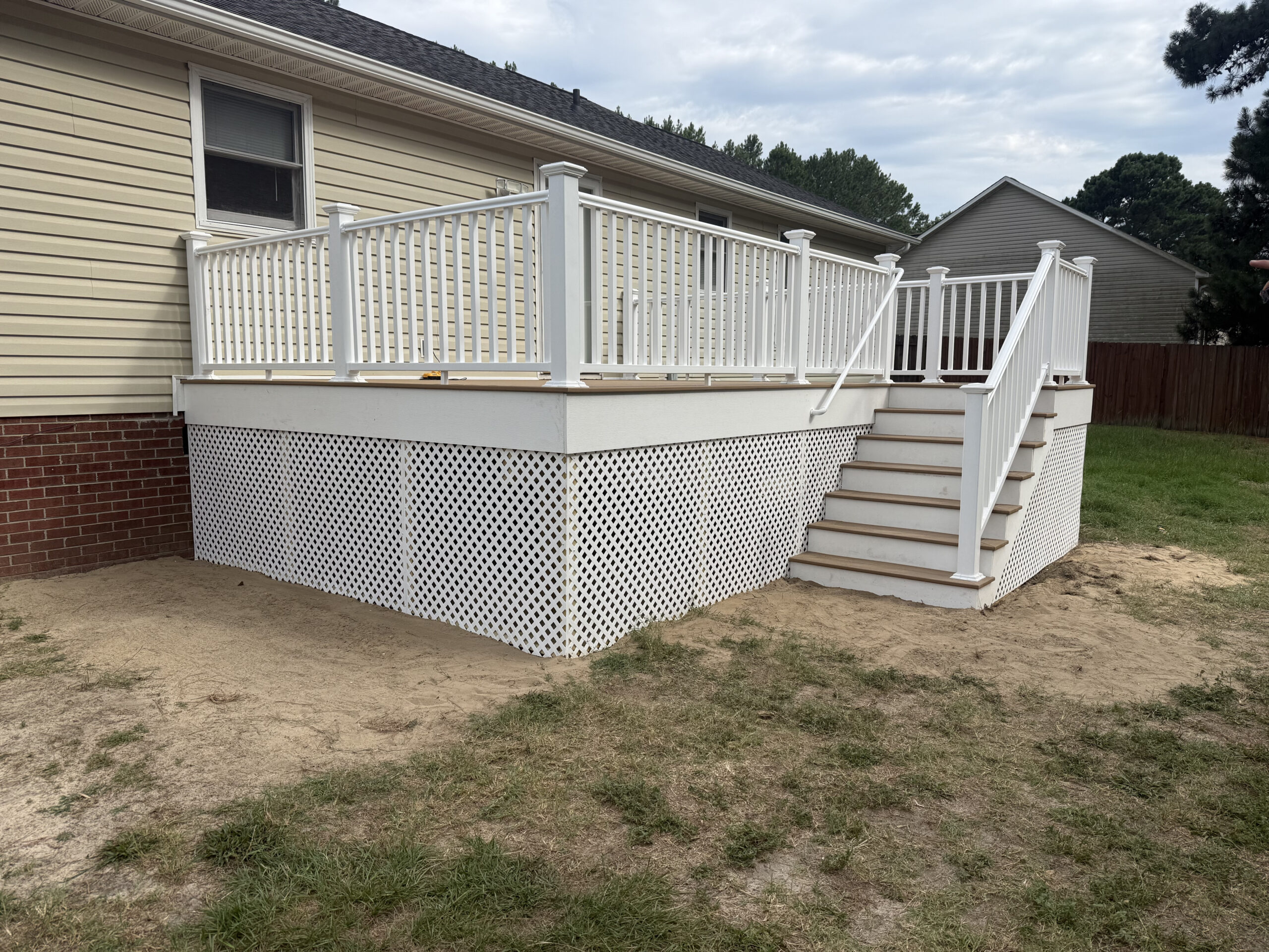 New custom composite deck with white railing built by Titan Decks in Cameron, NC