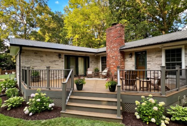 TimberTech composite deck with gray railing and stone home exterior in North Carolina